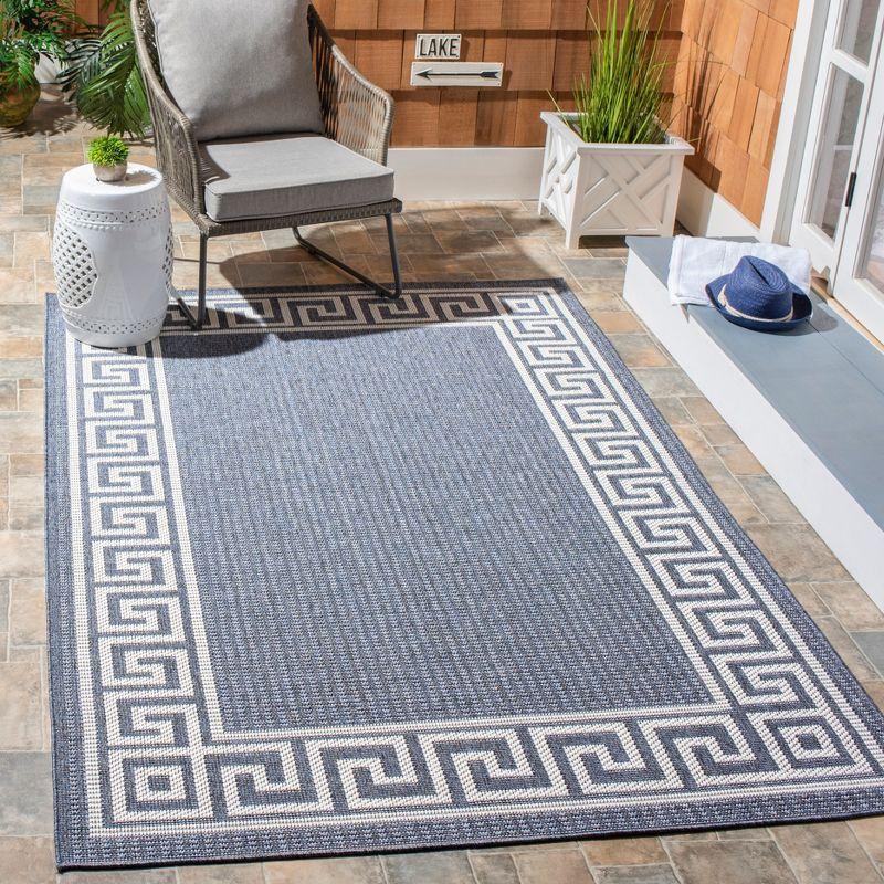 Bermuda BMU820 Power Loomed Indoor/Outdoor Area Rug - Dark Blue/Ivory - 6'7"x9'2" - Safavieh.