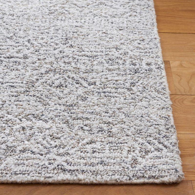 Ivory Hand Tufted Wool and Synthetic Area Rug