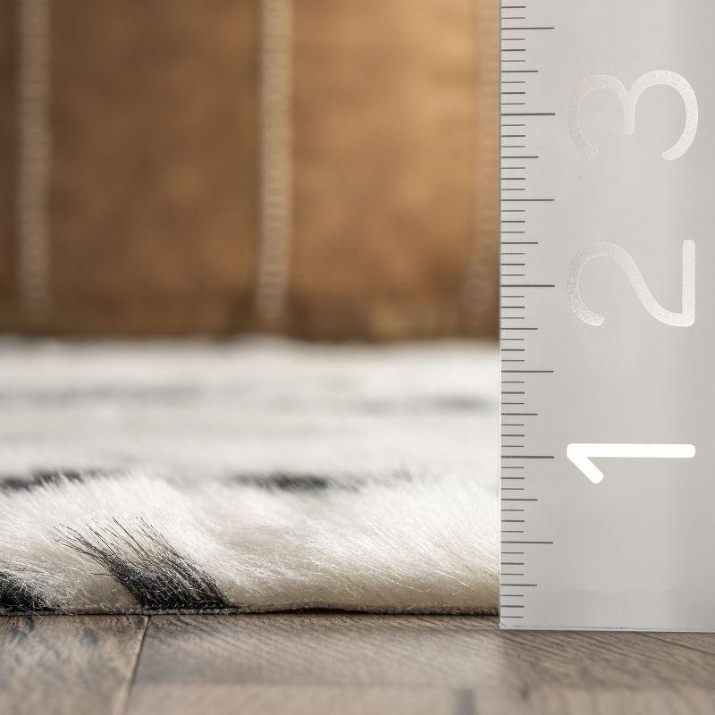 Nuloom Marcia SpinClean Machine Washable Faux Cowhide Area Rug, Shaped 3' 10" x 5', Black