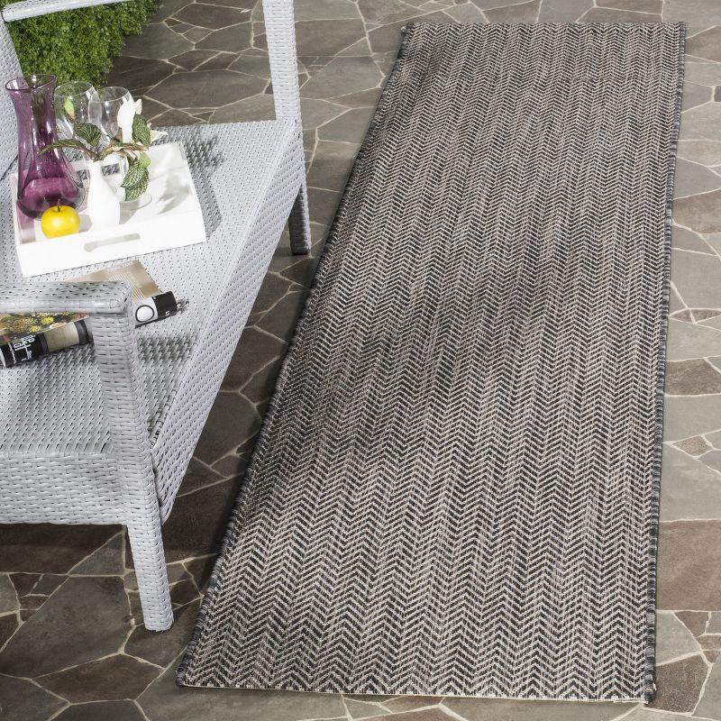 Black and Beige Flat Woven Synthetic Indoor/Outdoor Rug