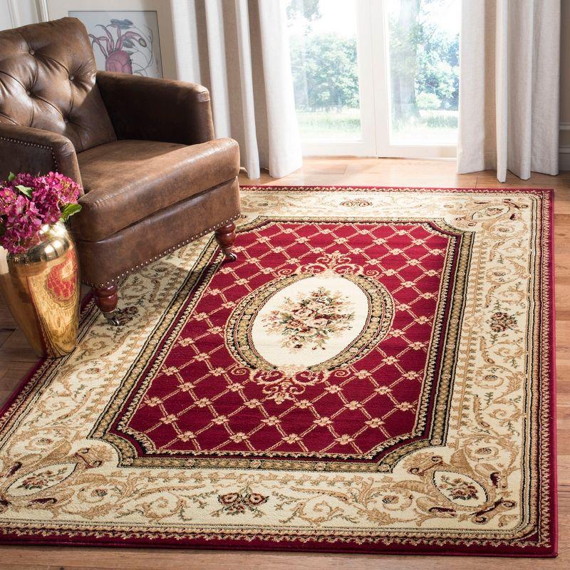 Red and Ivory Medium Pile Synthetic Traditional Area Rug