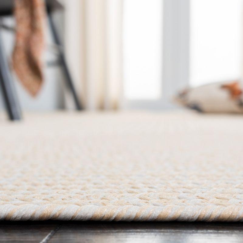 Handwoven Ivory Braided 5' x 8' Synthetic Area Rug