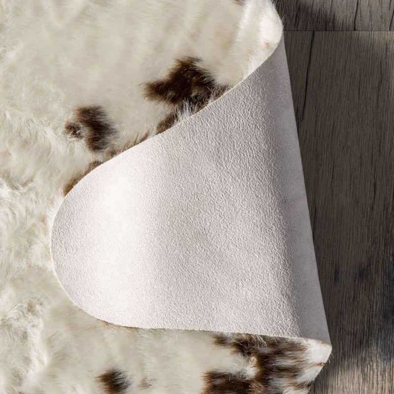 Nuloom Marcia SpinClean Machine Washable Faux Cowhide Area Rug, Shaped 3' 10" x 5', Brown