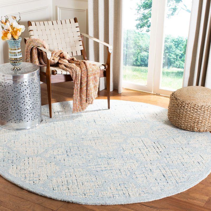 Ivory and Turquoise Round Tufted Wool Area Rug