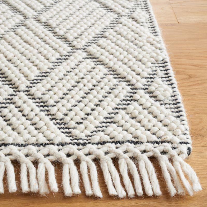 Handwoven Ivory and Black Wool 4' x 6' Area Rug