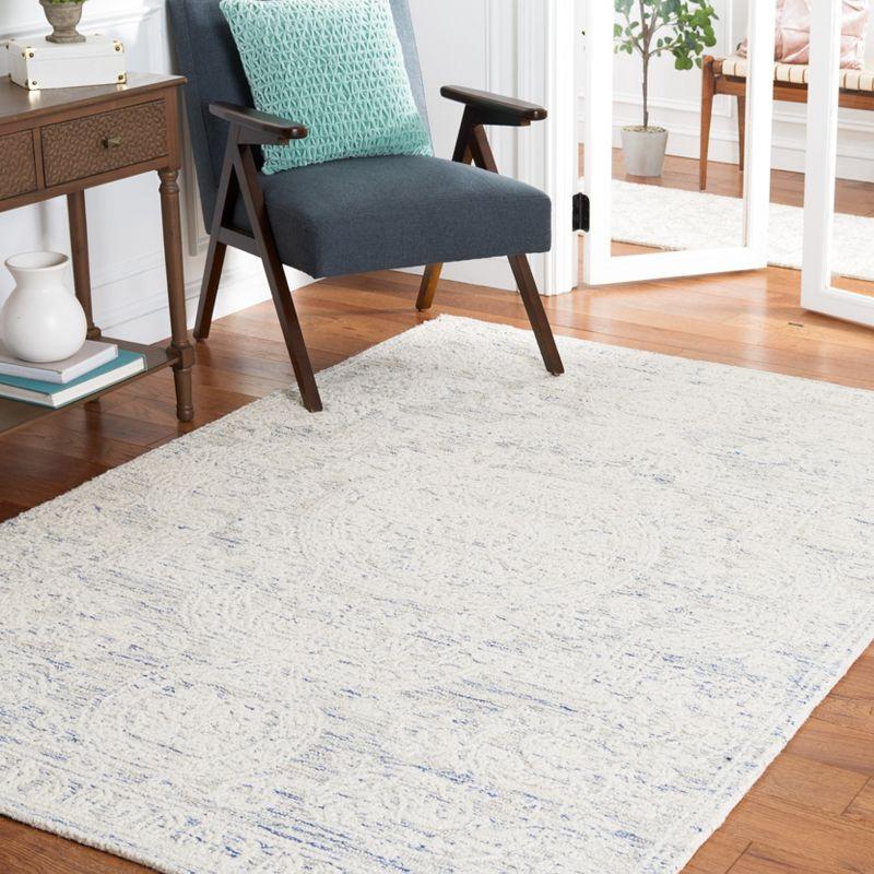 Ivory and Blue Handmade Wool Abstract Tufted Area Rug, 8' x 10'