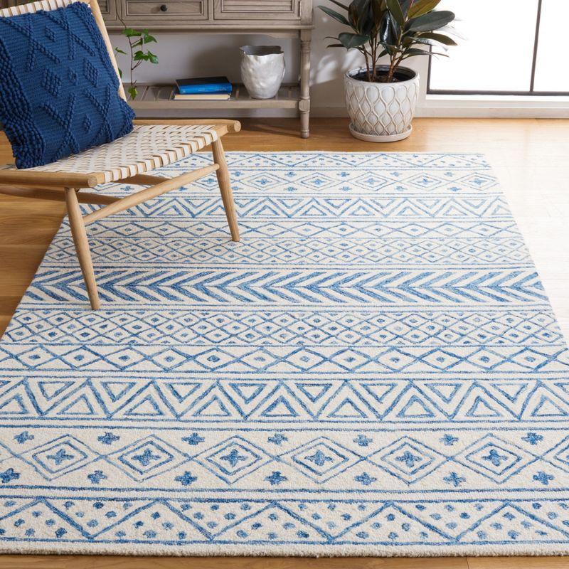 Ivory and Blue Hand-Tufted Wool Area Rug, 5' x 8'