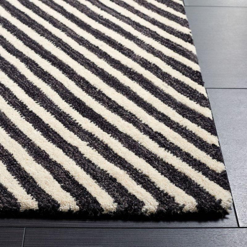 Ebony 3' x 5' Black and Ivory Hand Tufted Wool Area Rug