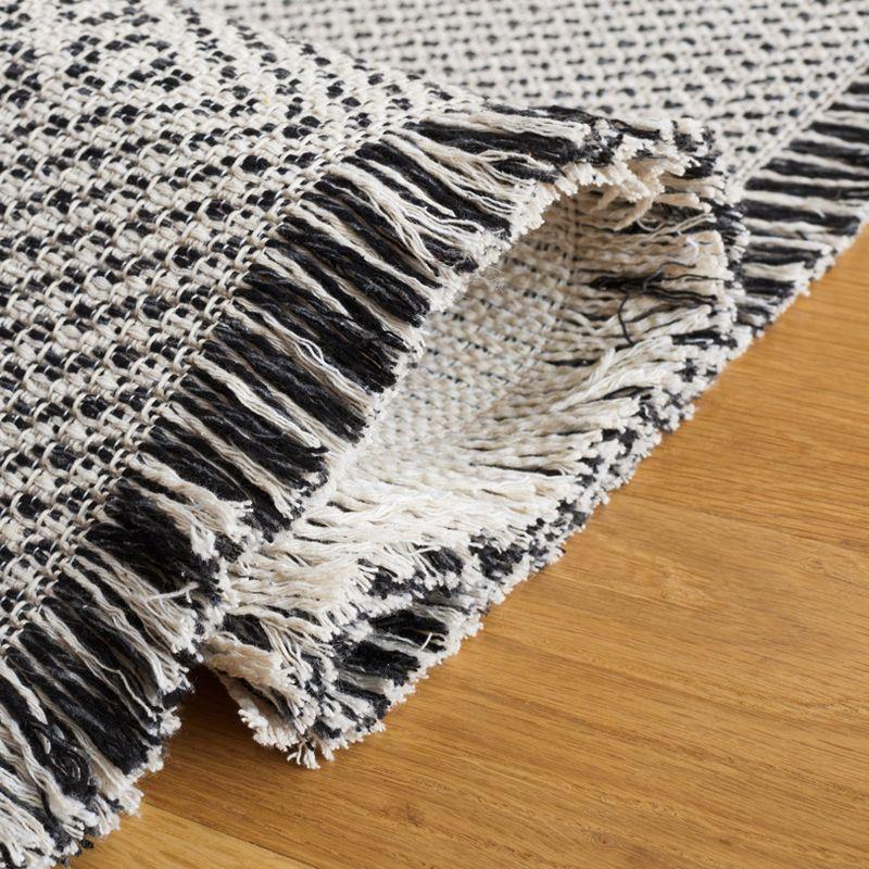 Augustine AGT502 Power Loomed Area Rug - Ivory/Black - 6'4"x9'6" - Safavieh.