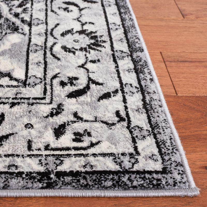 Rectangular 8' x 10' Black and Ivory Stain-Resistant Synthetic Rug