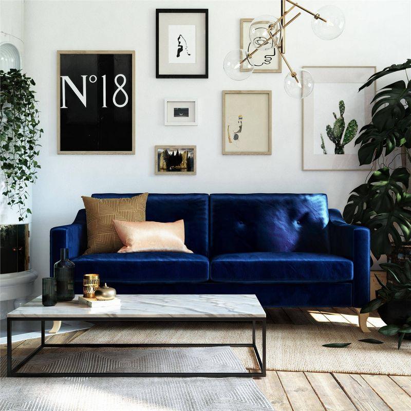 Luxe Blue Velvet Tufted Sofa with Sloped Arms and Wood Accents