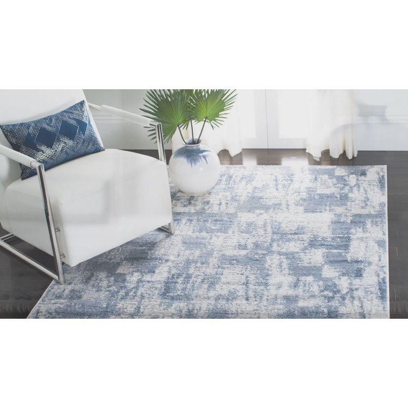 Ivory and Blue Abstract Synthetic Round Rug, 3' x 5'