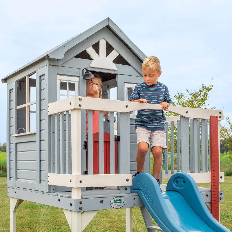 Backyard Discovery Backyard Discovery Beacon Heights Cedar Wooden Elevated Kids Playhouse with Wave Slide, Play Kitchen, and Deck