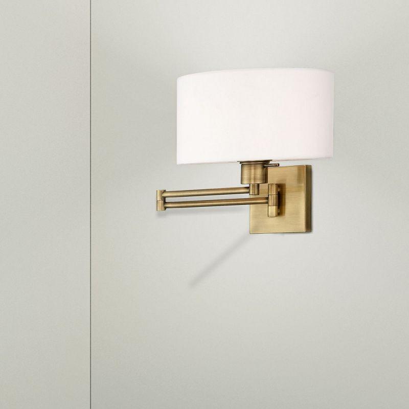 Sleek Transitional Black Swing Arm Wall Lamp with Off-White Fabric Shade