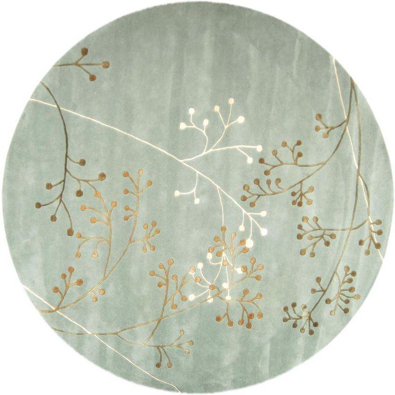 Soho SOH305 Hand Tufted Area Rug - Light Blue - 8' round - Safavieh.