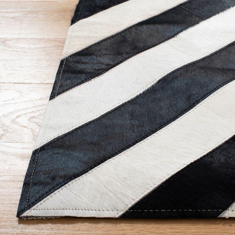 Hand-Knotted Geometric Black and White Cowhide Area Rug 5' x 8'