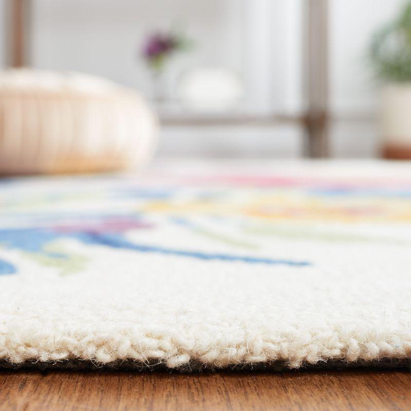 Chelsea HK219 Hand Tufted Area Rug - Ivory/Rose - 3'x5' Oval - Safavieh.
