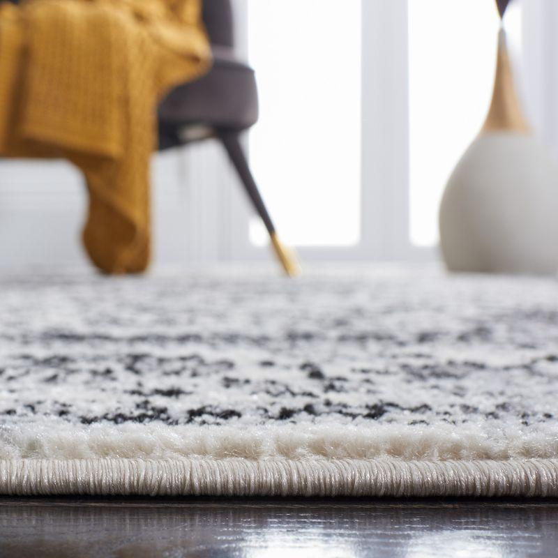 Ivory and Black Square Synthetic Area Rug