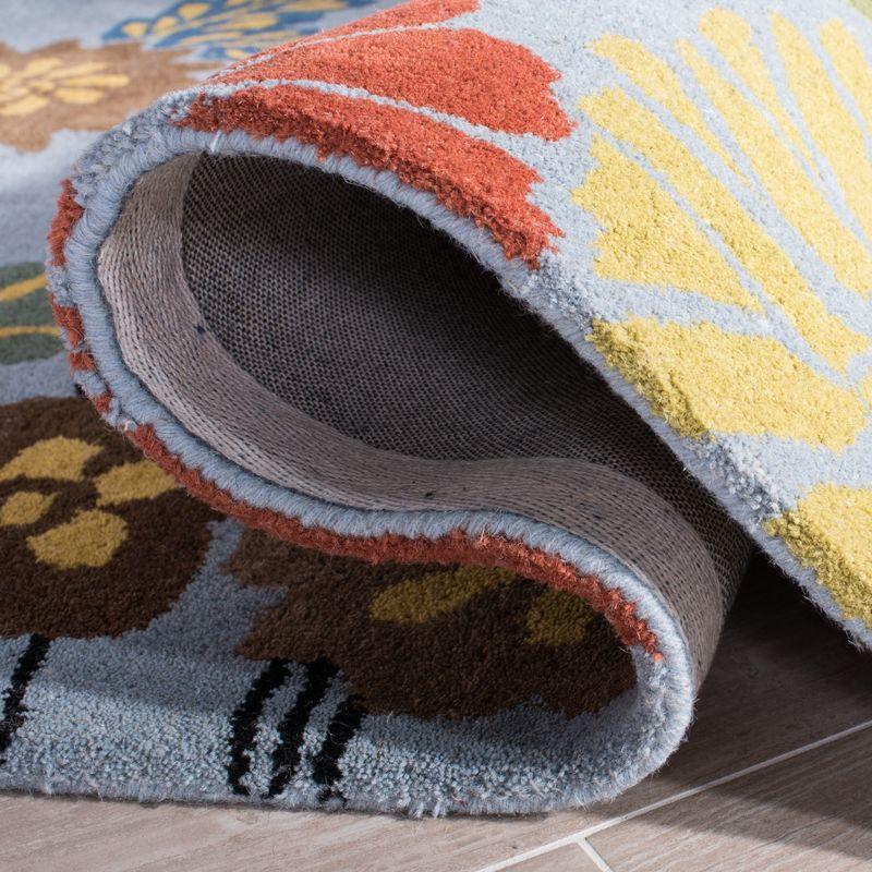 Soho SOH738 Hand Tufted Area Rug - Blue/Multi - 8'3"x11' - Safavieh.