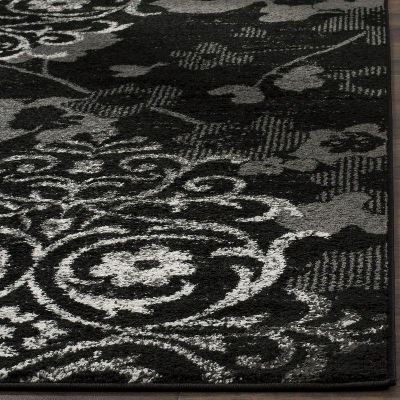 Elegant Black/Silver 9' x 12' Reversible Synthetic Area Rug