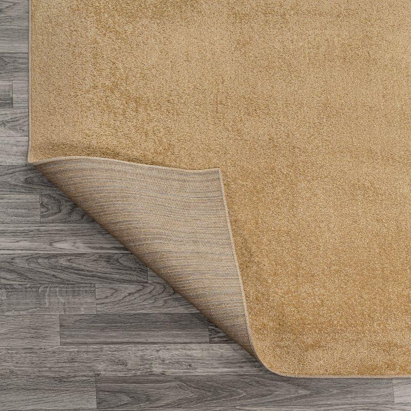 JONATHAN Y Twyla Classic Solid Low-Pile Machine-Washable Yellow 5 ft. x 8 ft. Area Rug