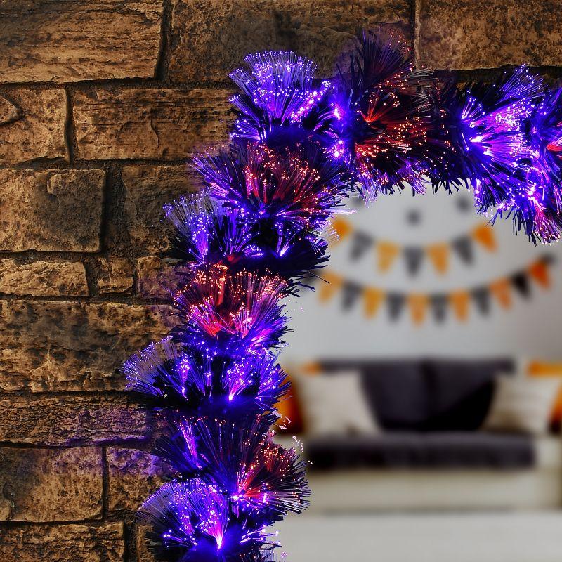 National Tree Company 9 ft. Black Fiber Optic Garland with Purple and Orange Lights