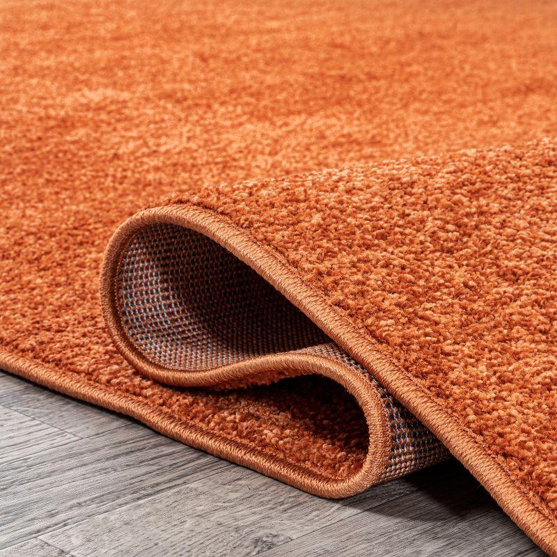 Haze Solid Low-Pile Orange 10 ft. x 14 ft. Area rug -JONATHAN Y