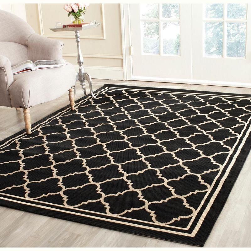 Black and Beige Synthetic Flat Woven Outdoor Area Rug 2'7" x 5'