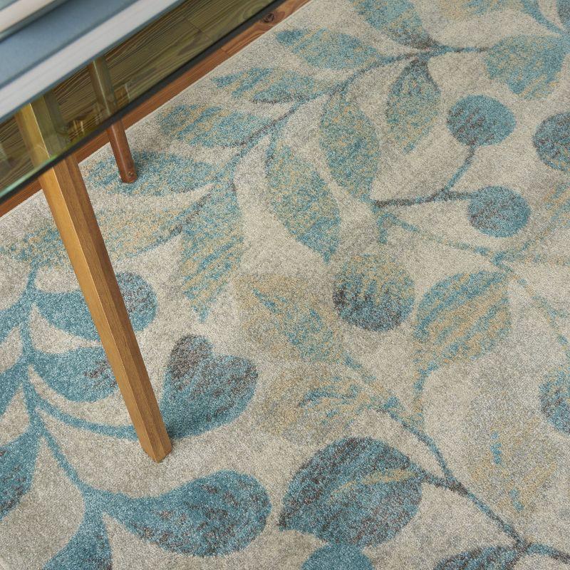 Ivory and Turquoise Floral Synthetic 4' x 6' Area Rug