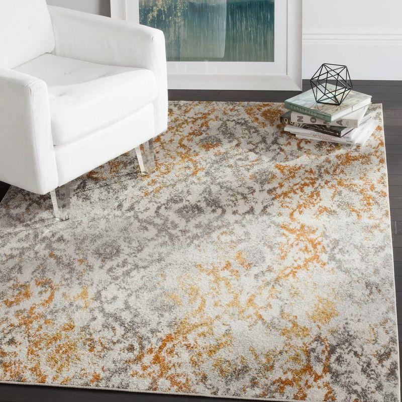 Ivory and Orange Damask Low Pile Area Rug