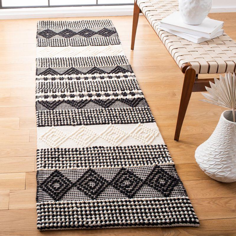 Hand-Tufted Black and Ivory Wool Area Rug