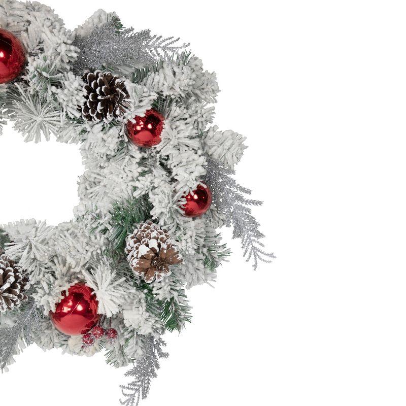 The Holiday Aisle® Flocked Pine with Red Ornaments Artificial Lemuella Wreath 24-Inch Unlit