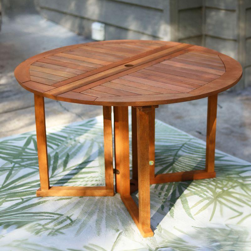 Sunnydaze Malaysian Hardwood Gateleg Round Patio Table with Teak Oil Finish - 47.25" Diameter x 29" H