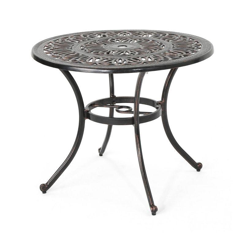 Fleur De Lis Living Outdoor Round Cast Aluminum Dining Table, Shiny Copper | Wayfair