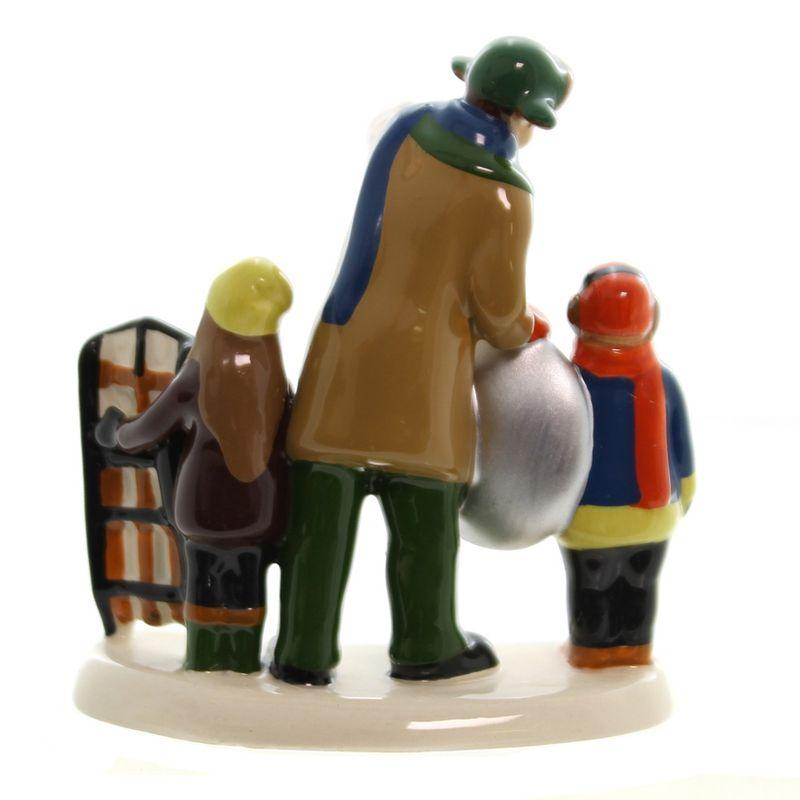 Multicolored Ceramic Christmas Vacation Sledding Scene Figurine