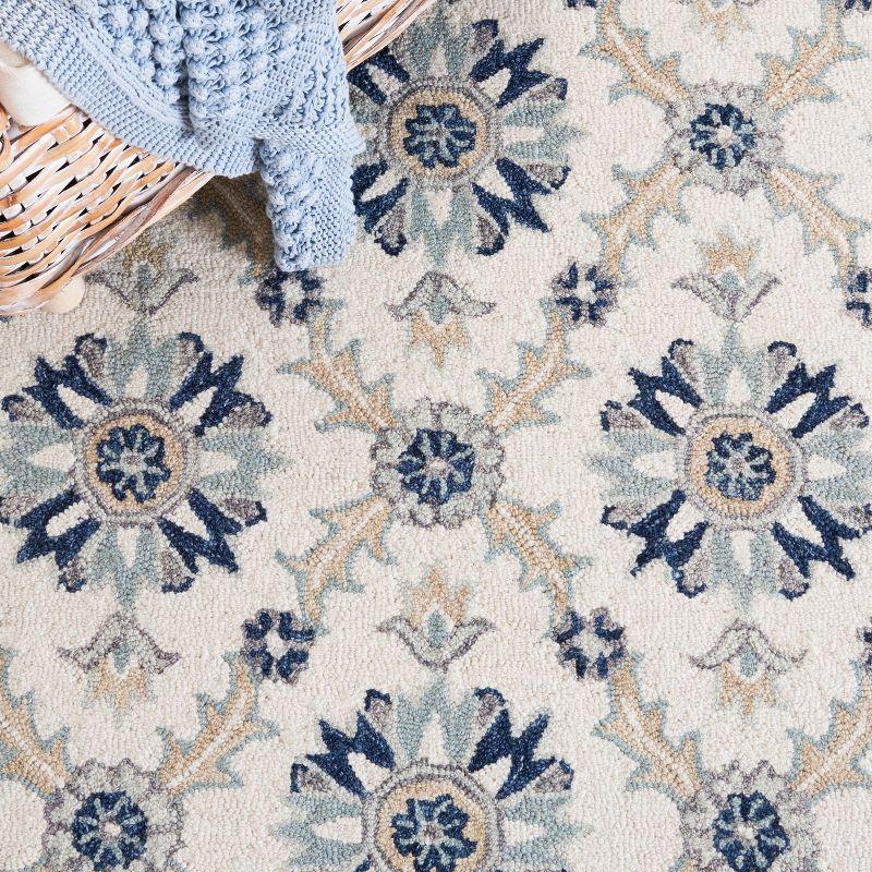 Ivory and Blue Floral Tufted Wool Rug 4' x 6'