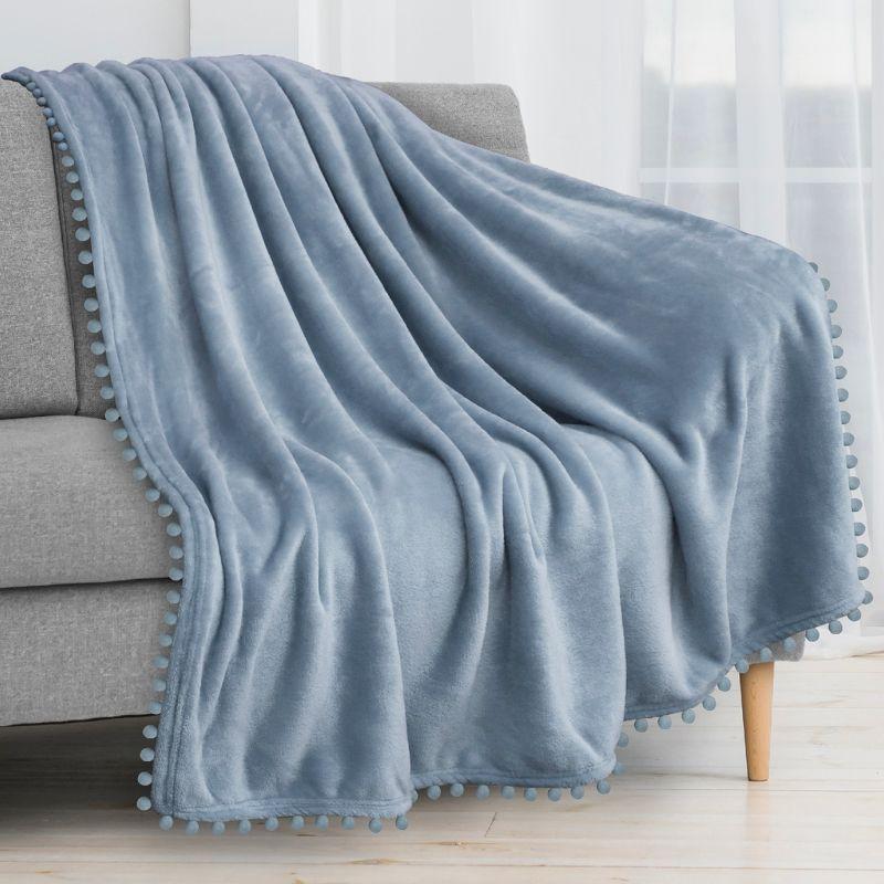 PAVILIA Fleece Pom Pom Blanket Throw for Sofa Bed, Soft Lightweight Pompom Fringe Blanket for Couch