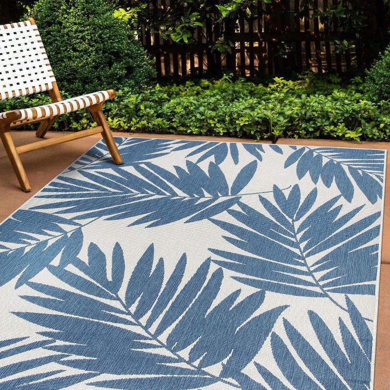 Blue and White Floral Synthetic Reversible 5' x 7' Area Rug