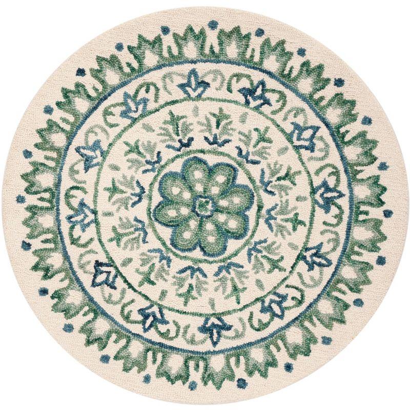 Novelty NOV607 Hand Tufted Area Rug - Ivory/Teal - 4' round - Safavieh.