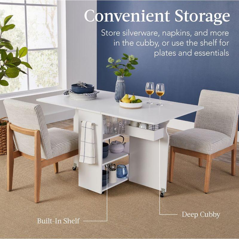 Best Choice Products Multipurpose Folding Table w/ Wheels, 3 Storage Shelves, Cubby, Handle - White