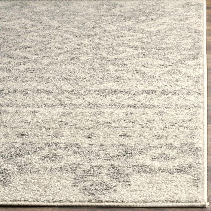 Chic Ivory & Silver Synthetic 10' x 14' Easy-Care Area Rug