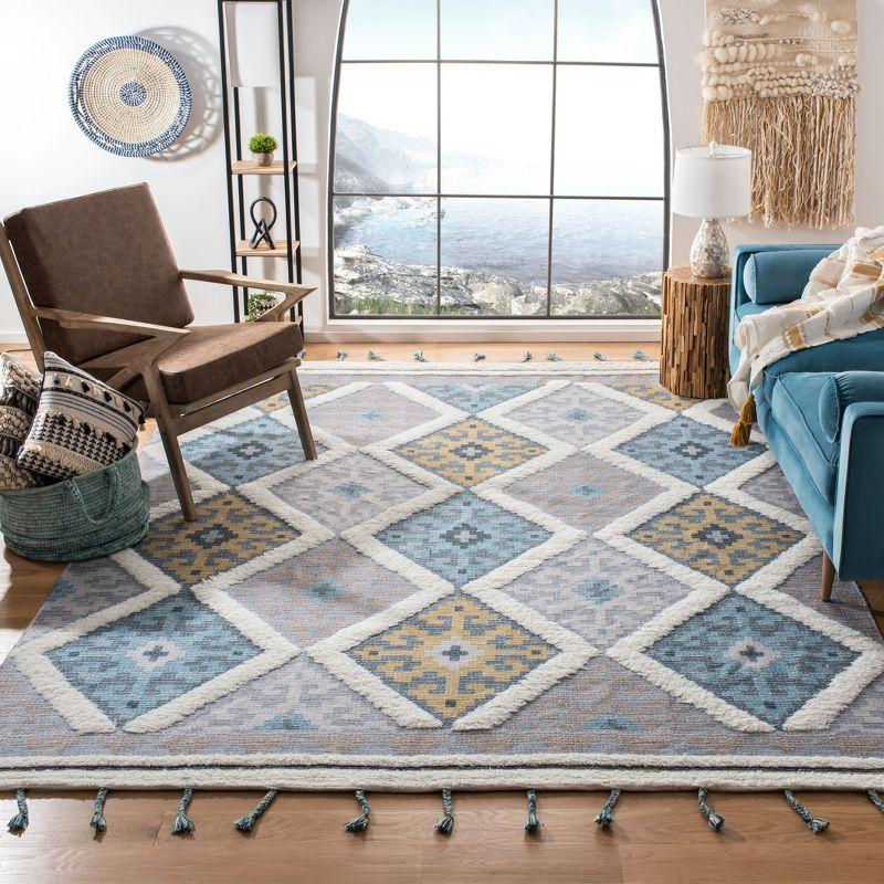 Saffron Ivory and Turquoise Wool 8' x 10' Hand Loomed Area Rug