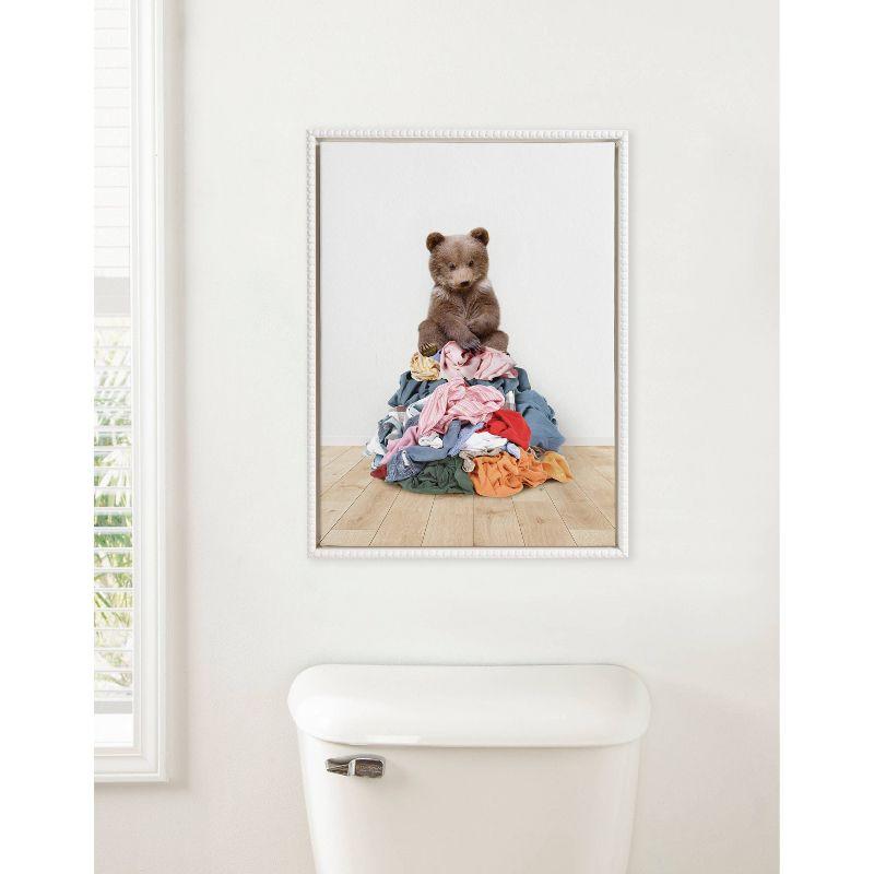 18"x24" Sylvie Beaded Bear on Laundry Pile Scandi Style Framed Canvas by Amy Peterson White - Kate & Laurel All Things Decor