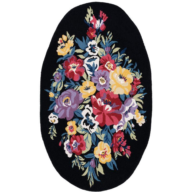 Handmade Chelsea Floral Black Wool Oval Rug - 4' x 6'