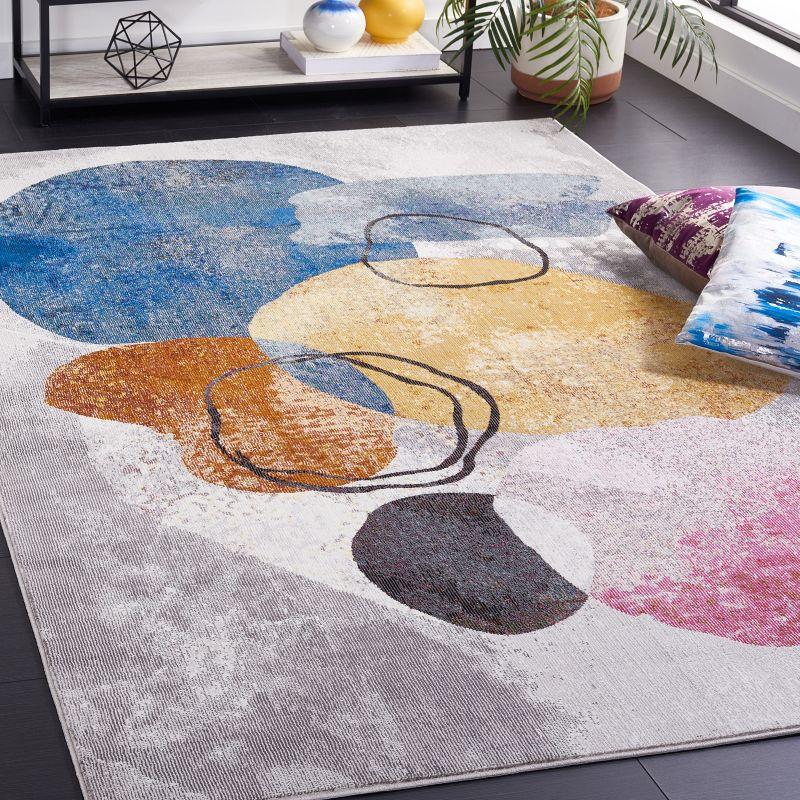 Ivory and Multicolor Abstract 8' x 10' Synthetic Area Rug