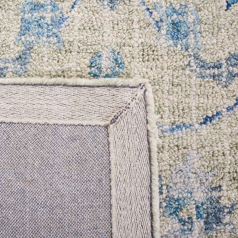 Handmade Tufted Blue Floral Wool Accent Rug