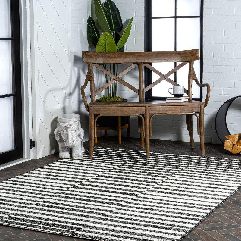 Ivory and Black Stripe Synthetic 8' x 10' Easy-Care Rug