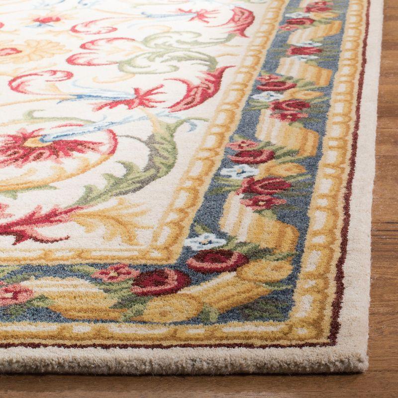 Handmade Ivory Floral Tufted Wool Area Rug 5' x 8'