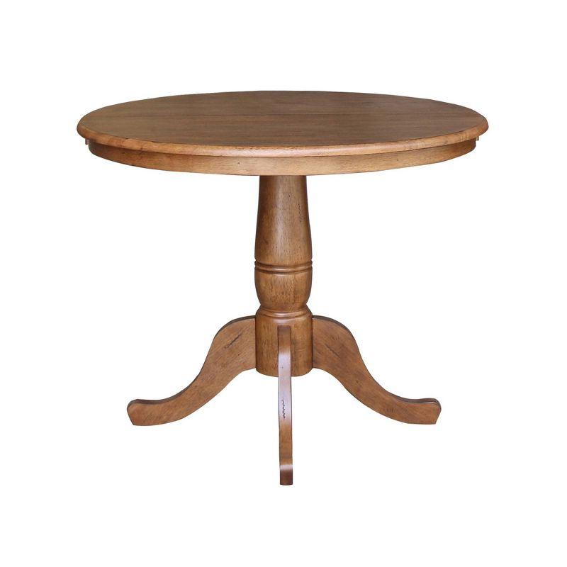 Keanan Round Top Pedestal Table with 12" Drop Leaf Distressed Oak - International Concepts