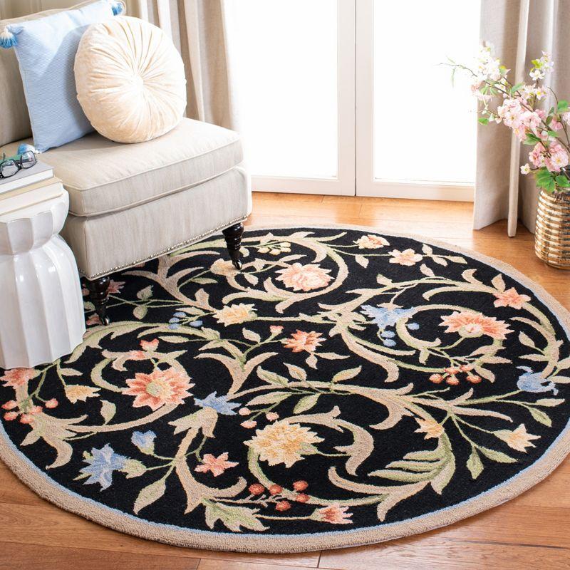 Handmade Black Floral Wool Round Tufted Rug, 7'